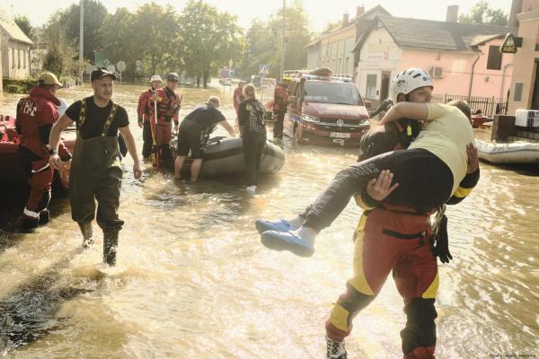 Emergency service personnel help evacuate residents from the flooded town of Lewin Brzeski, southwestern Poland, on Tuesday, Sept. 17, 2024. 